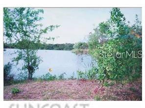 a view of a lake with mountain in the background