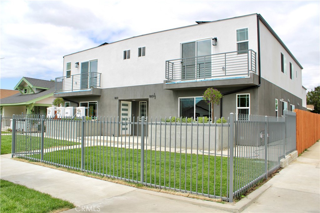 a view of a house with a backyard and a garden