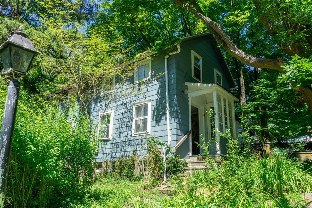 front view of a house with a garden