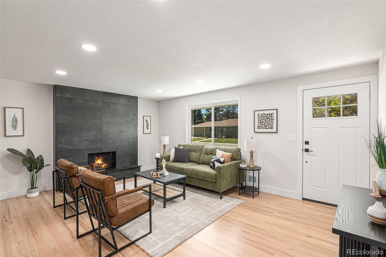 a living room with furniture and a fireplace