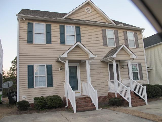 a front view of a house with a porch