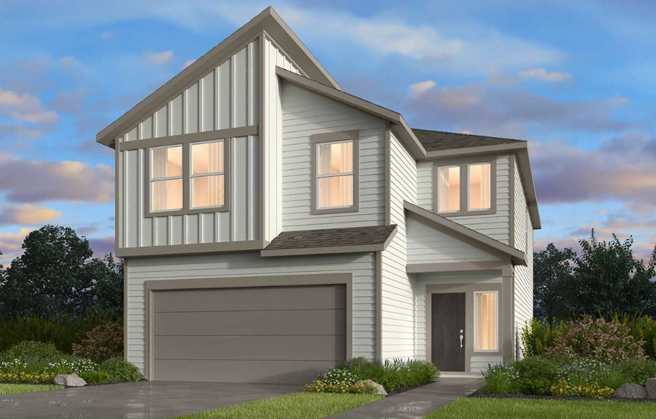 a front view of a house with garage and plants