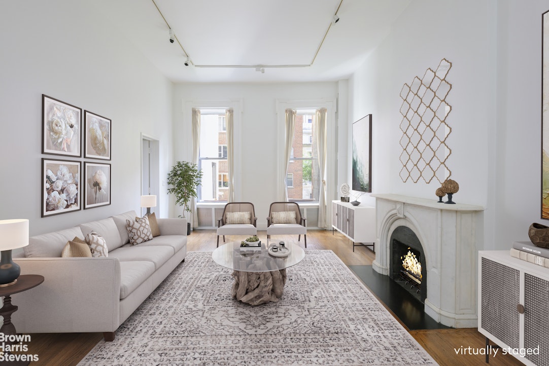 a living room with furniture fireplace and window