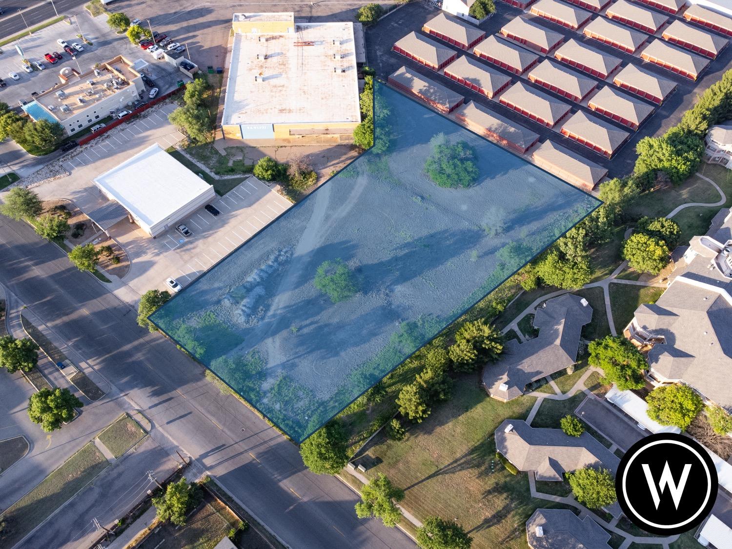 an aerial view of a house with outdoor space