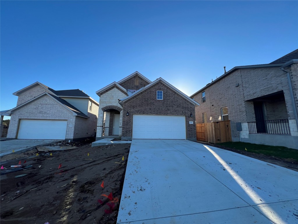 a front view of a house with yard