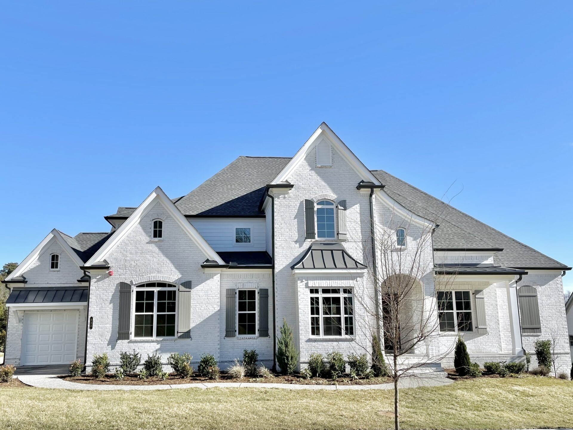 a front view of a house with a yard