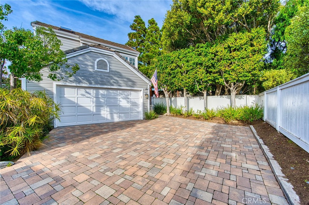 a front view of a house with a yard and a garage