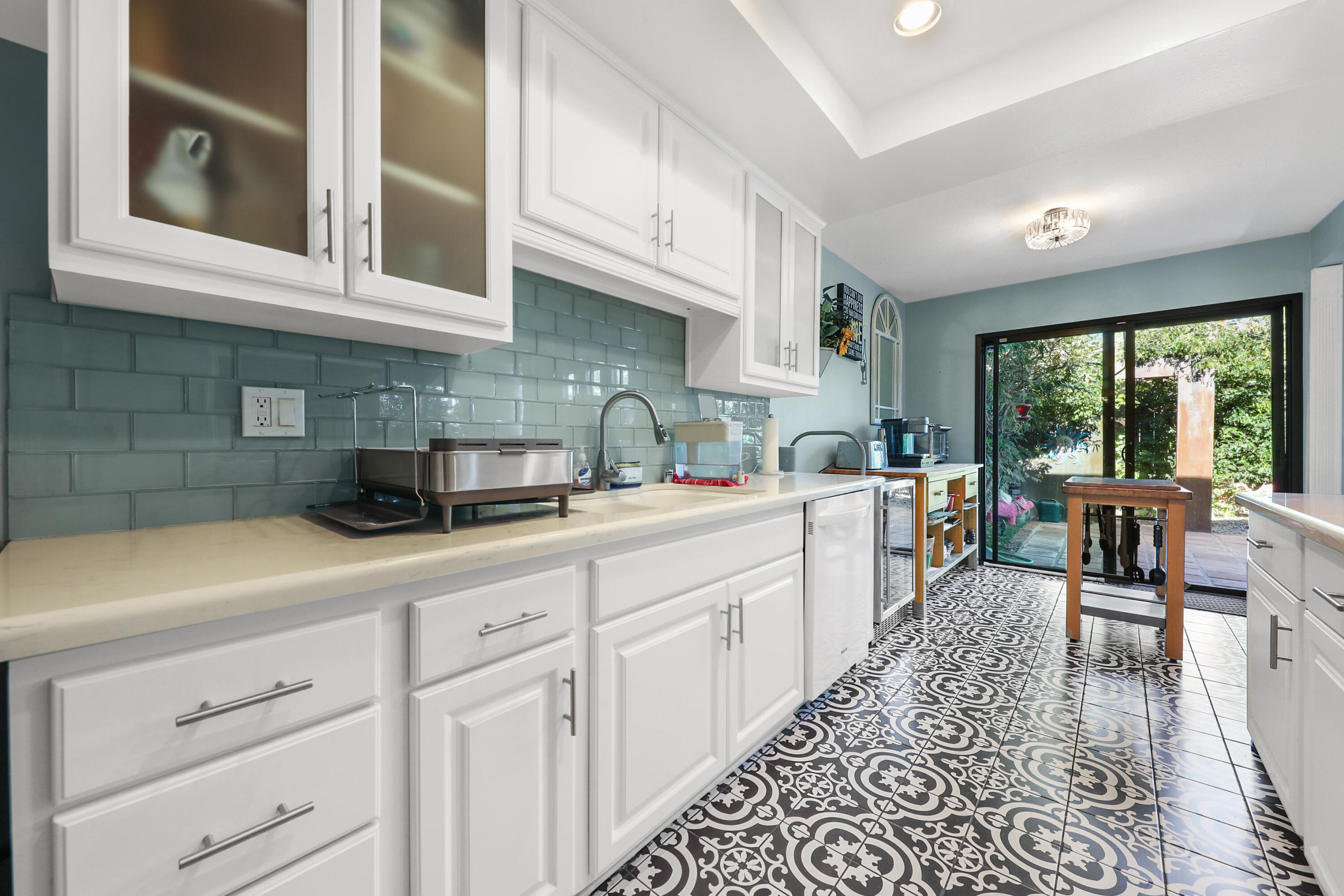 a kitchen with cabinets and window