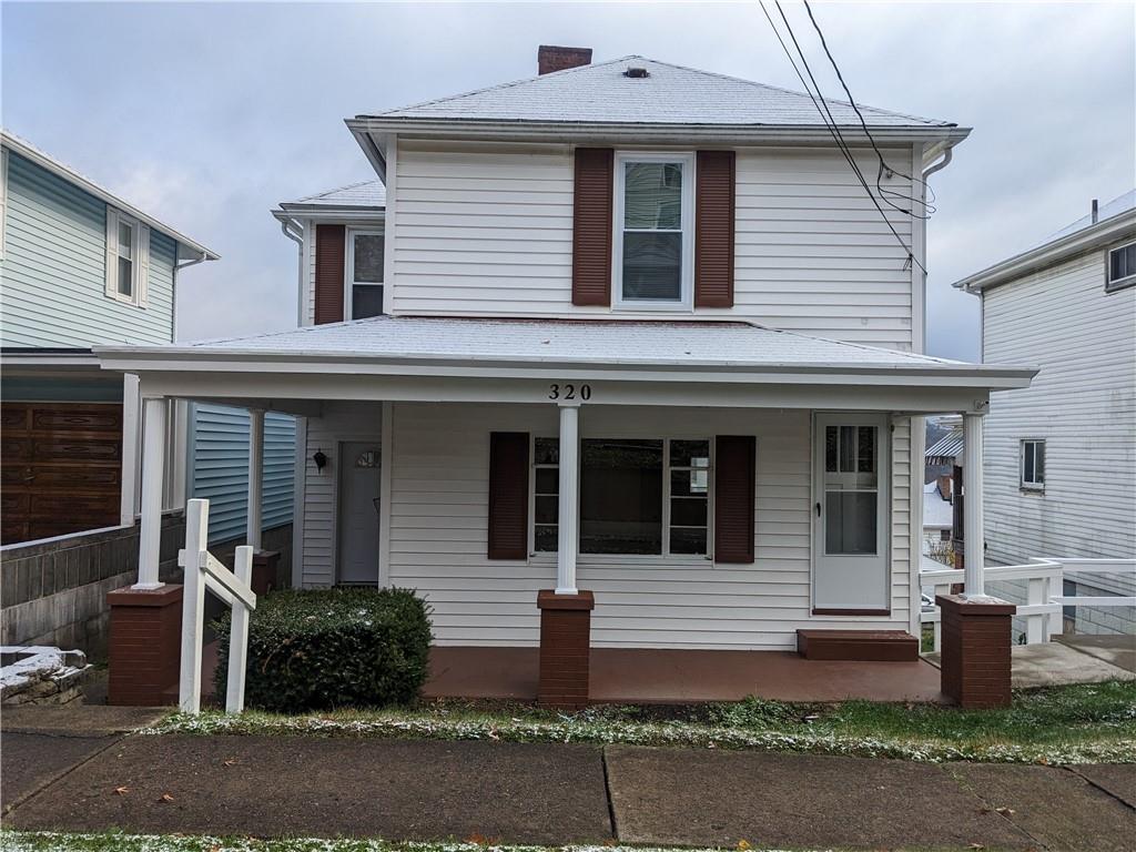 a front view of a house with yard