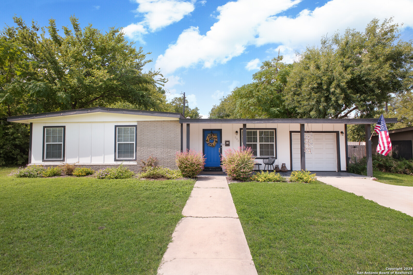 front view of a house with a patio