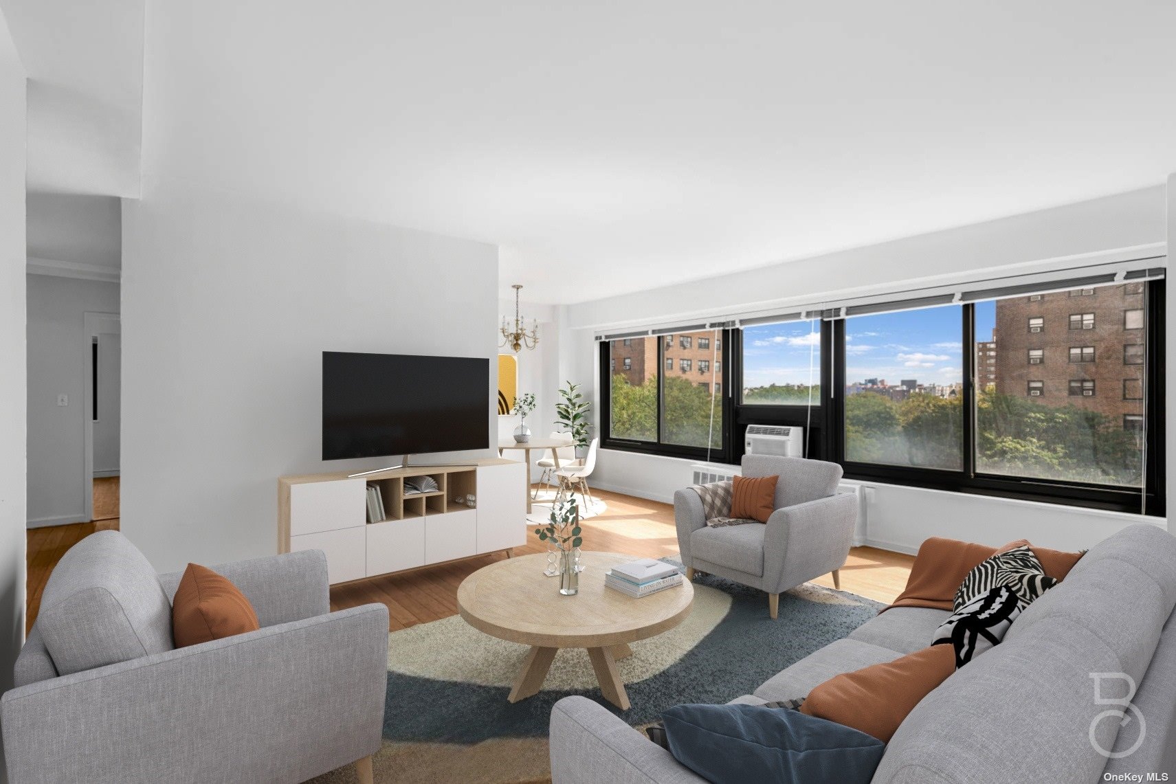 a living room with furniture and a flat screen tv