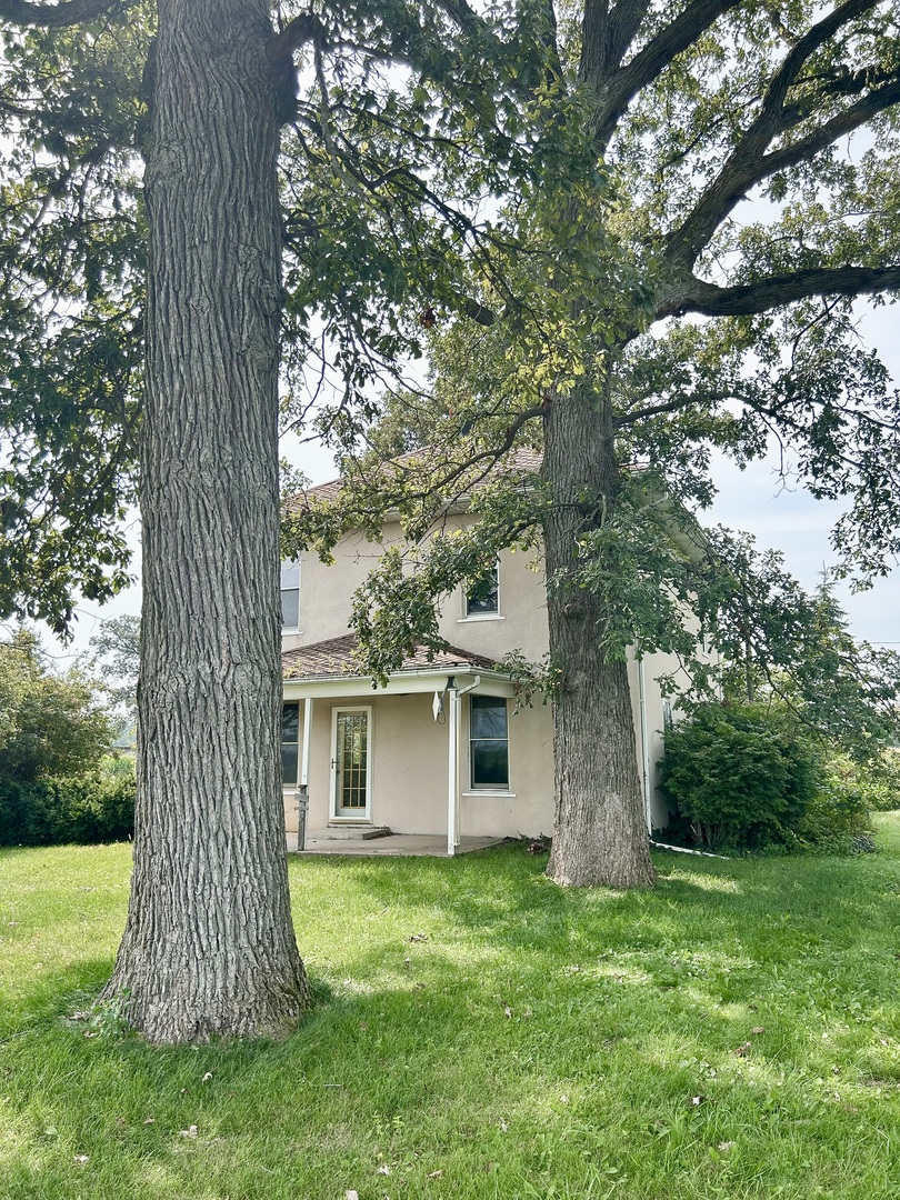 a view of a house with a garden