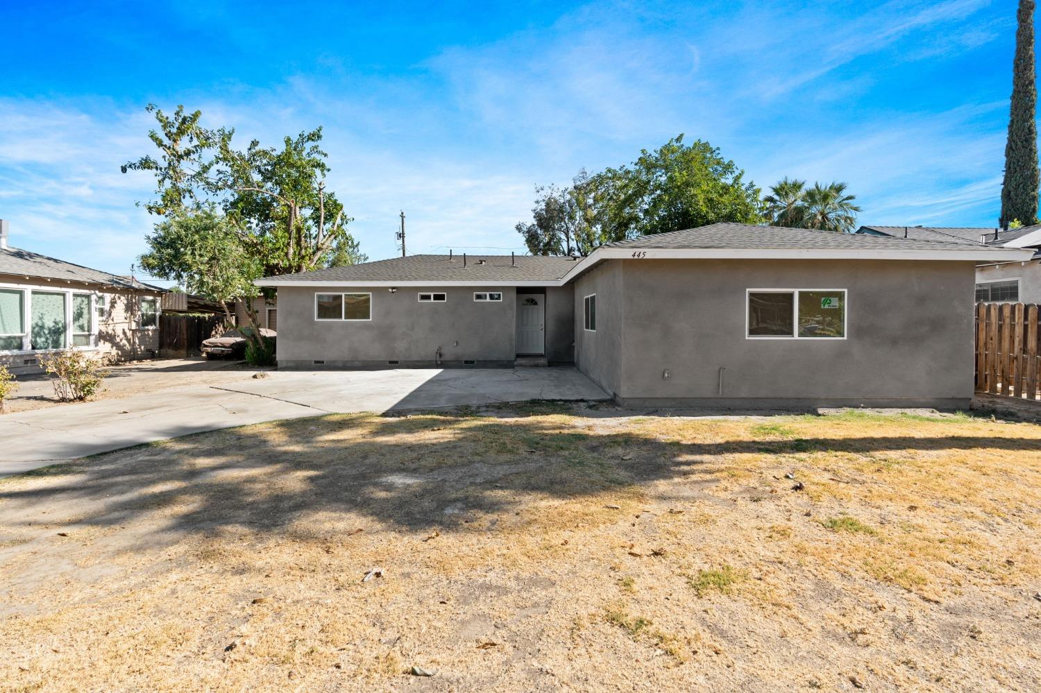 a view of the house with a yard