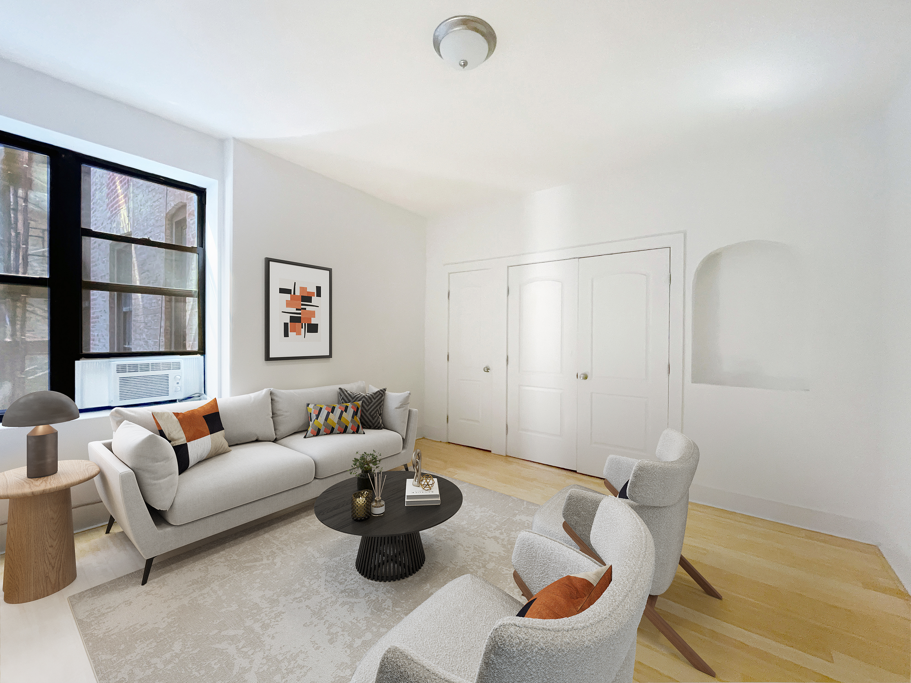 a living room with furniture and a book shelf