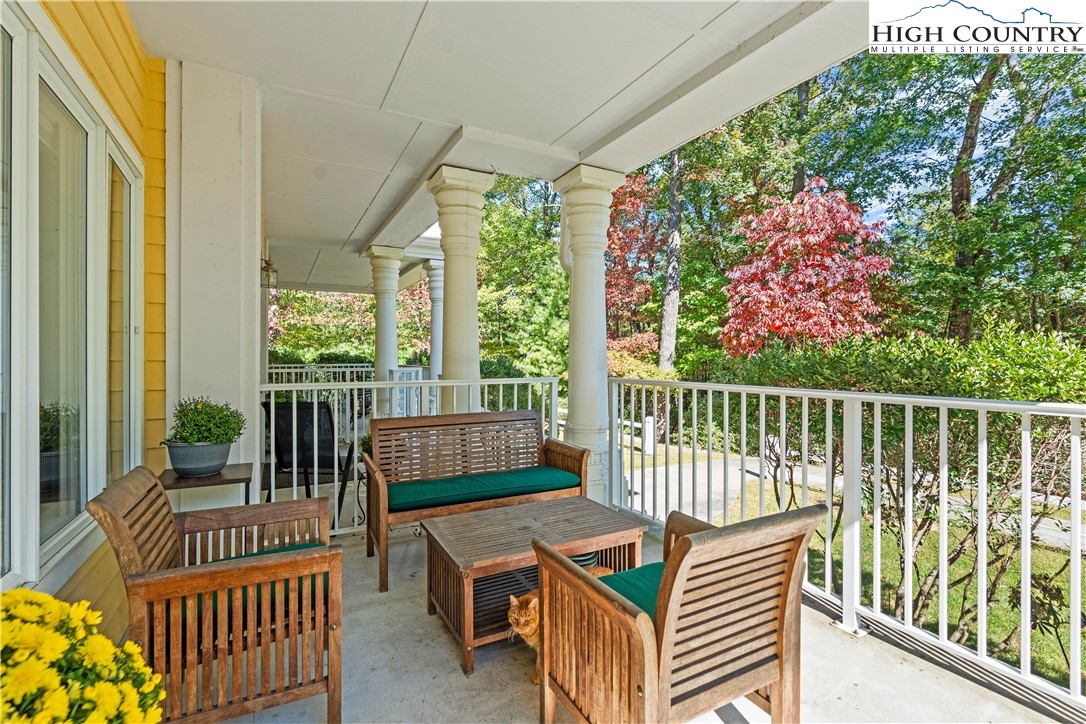 a view of balcony with furniture