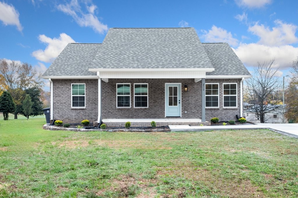 a front view of a house with a yard