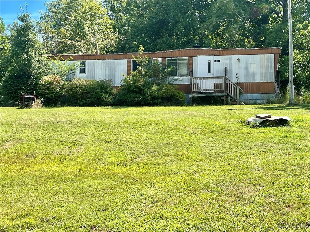 View of front of property with a deck and a front