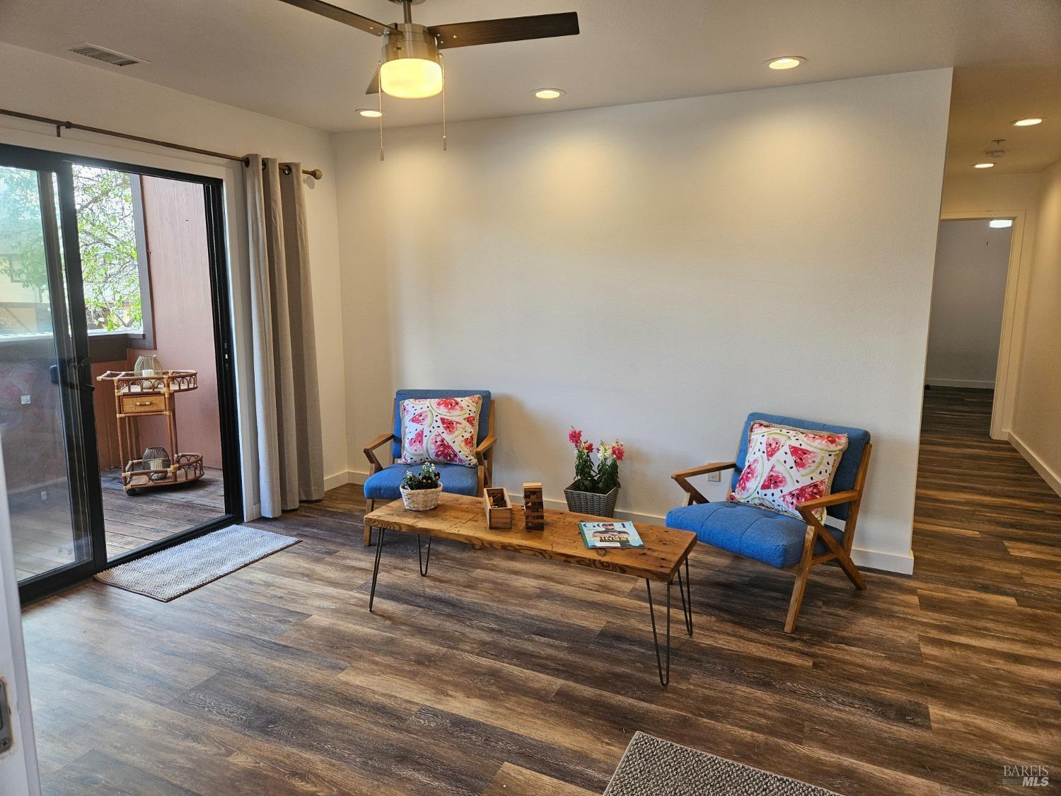 a living room with furniture and a gate