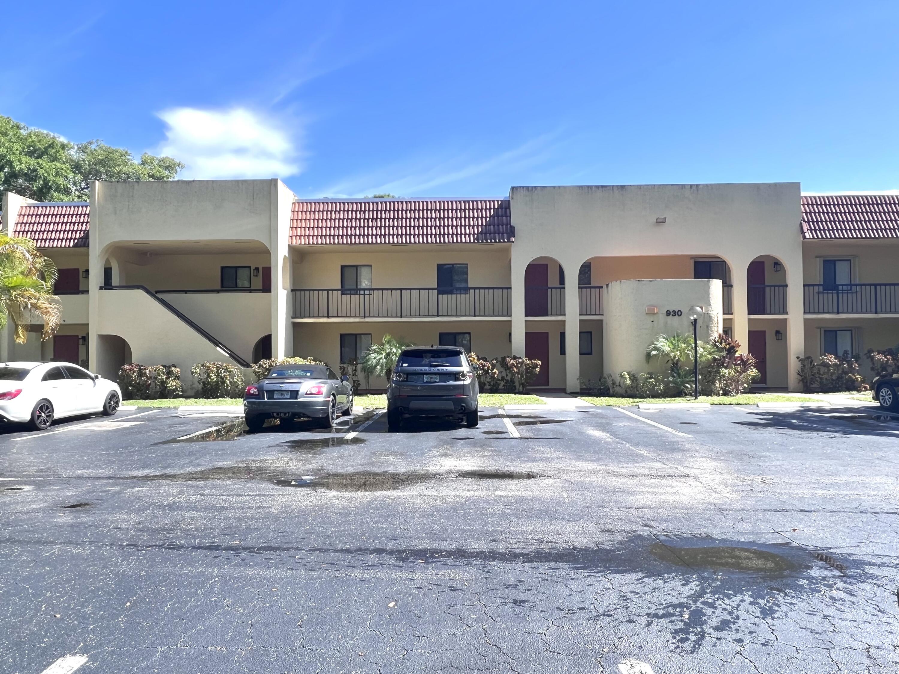 a view of a house with a outdoor space and parking