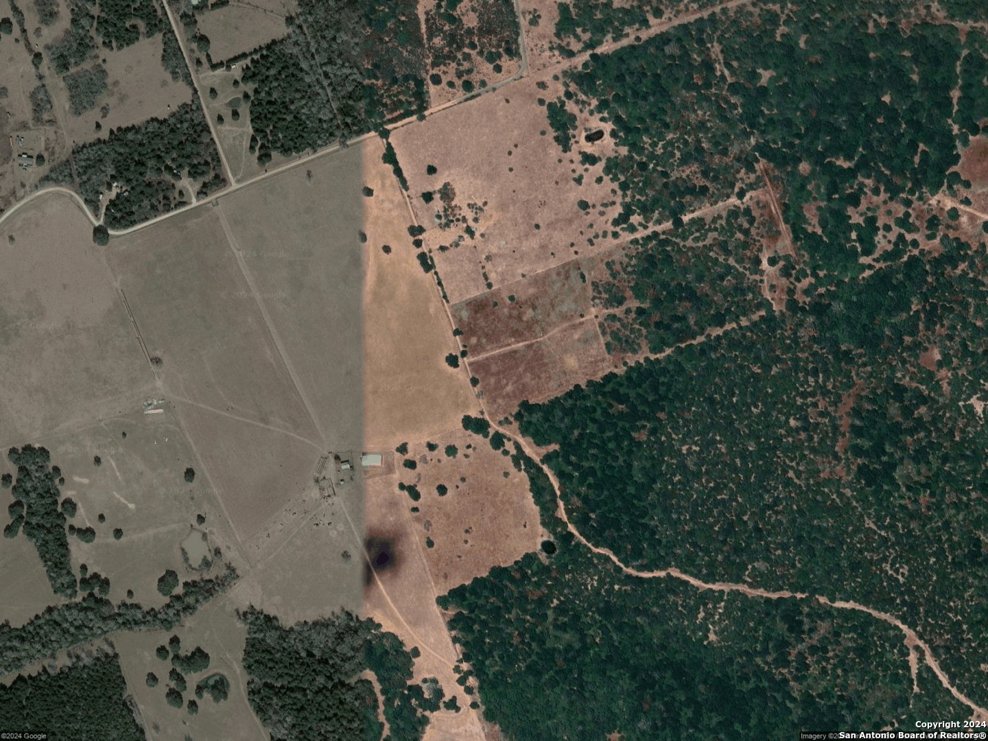 an aerial view of house with yard