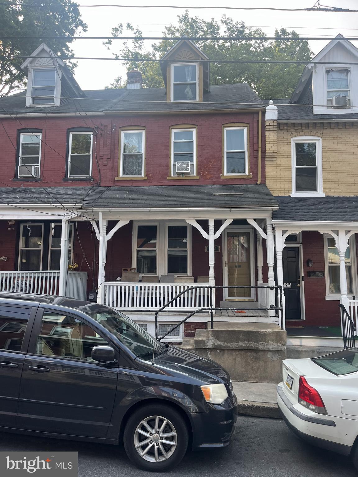 a front view of a house with parking space