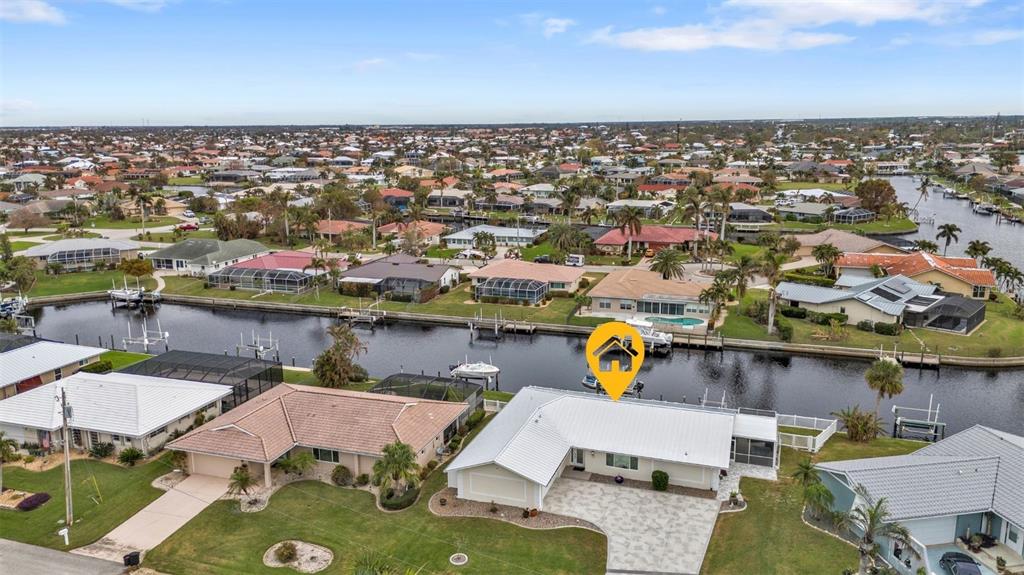 an aerial view of a house with a swimming pool