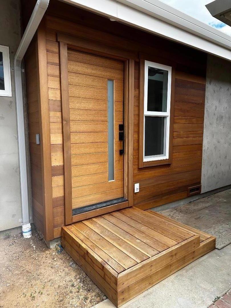 a view of a backyard with a large window