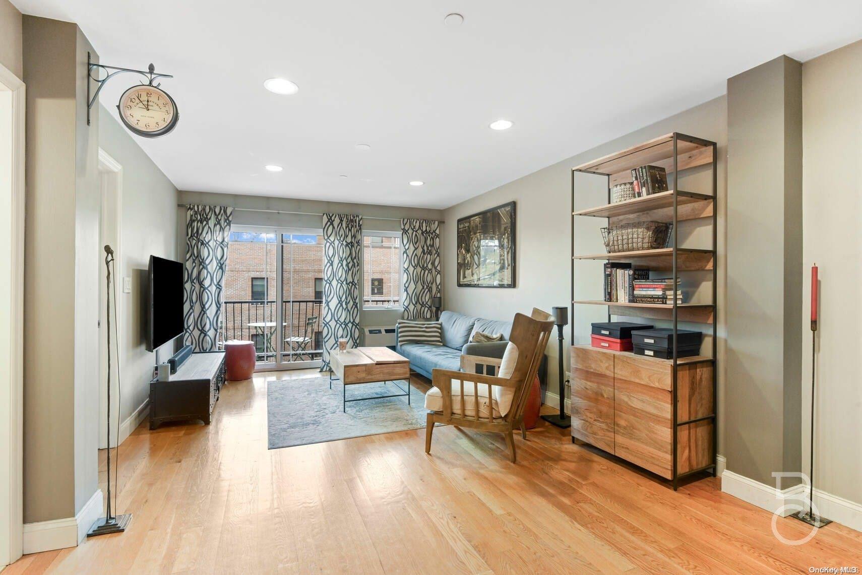 a living room with fireplace furniture and a flat screen tv