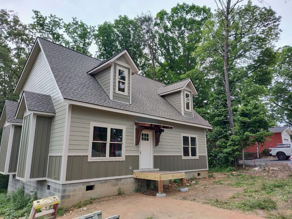 a front view of a house with yard