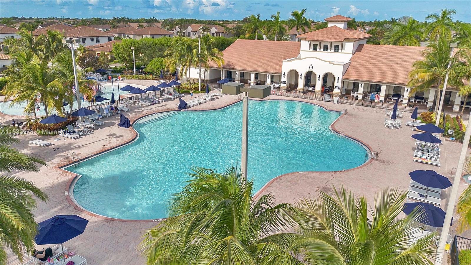 a view of a swimming pool with a patio