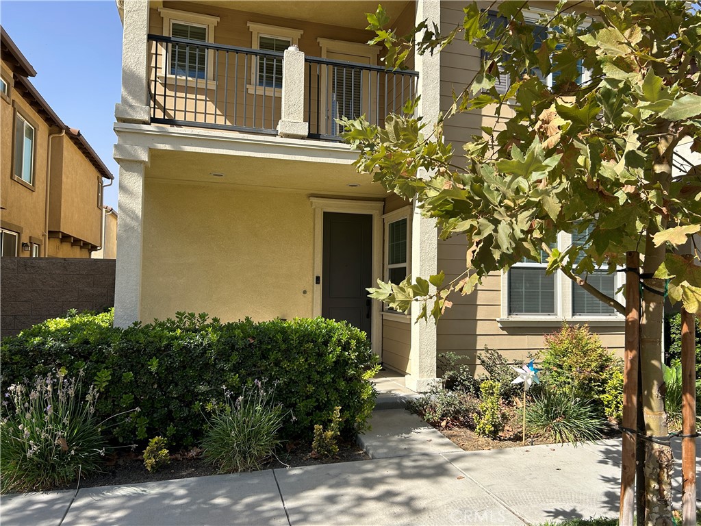 a front view of a house with trees