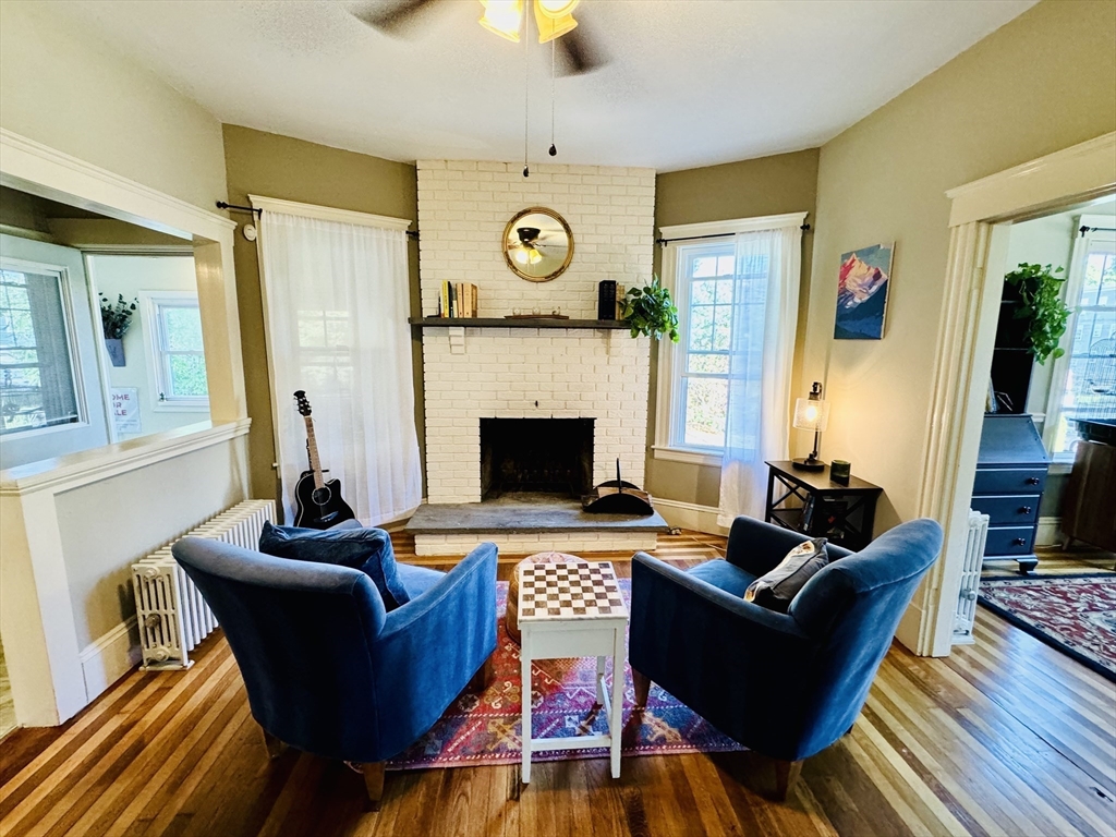 a living room with furniture and a fireplace