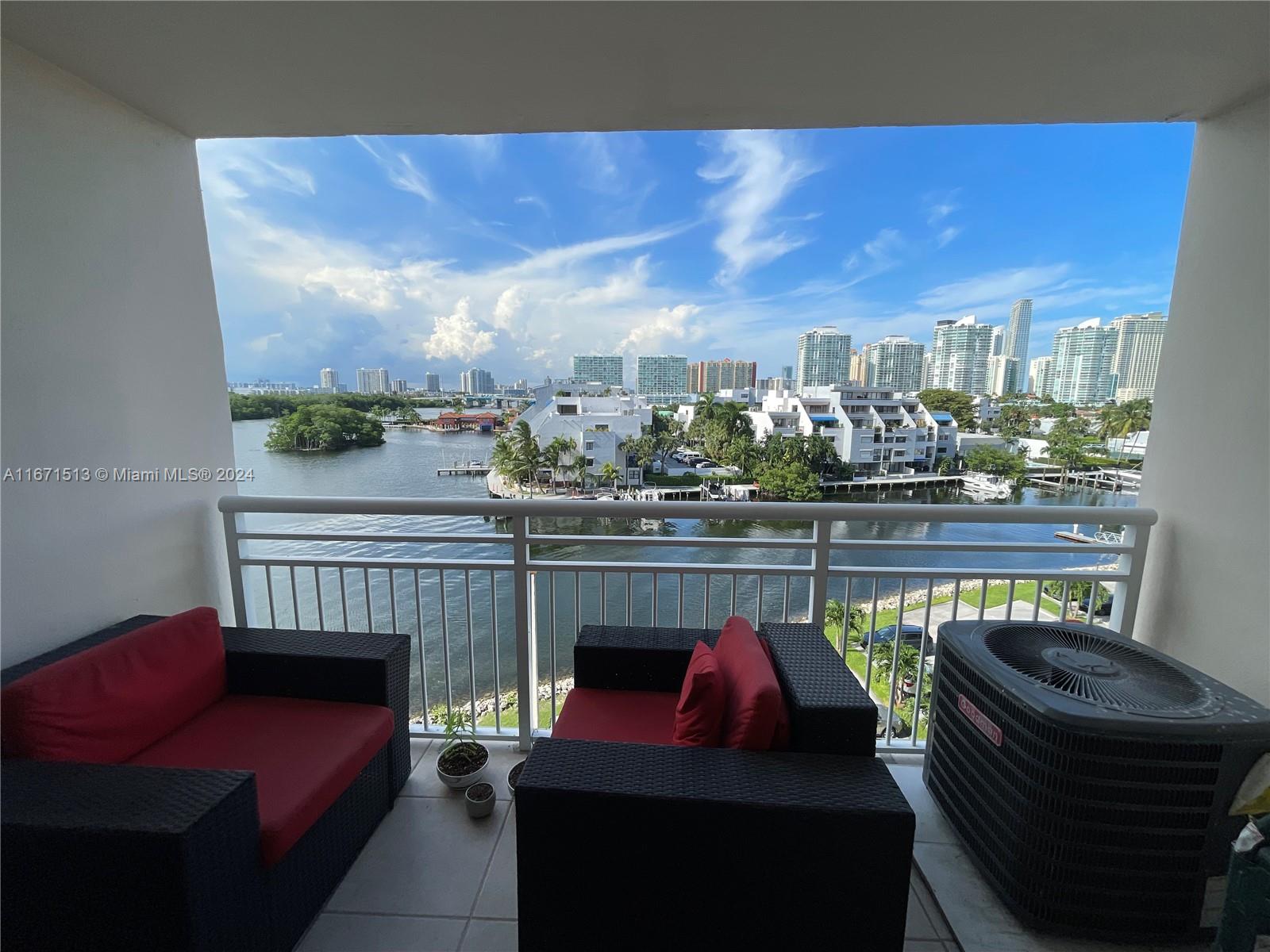 a view of a balcony with furniture