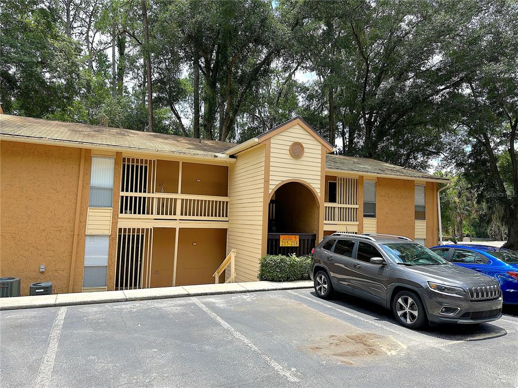 a front view of a house with parking space