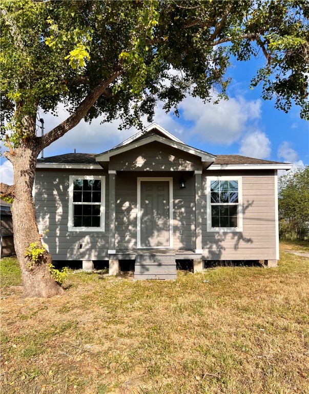 a front view of house with swimming pool and furniture