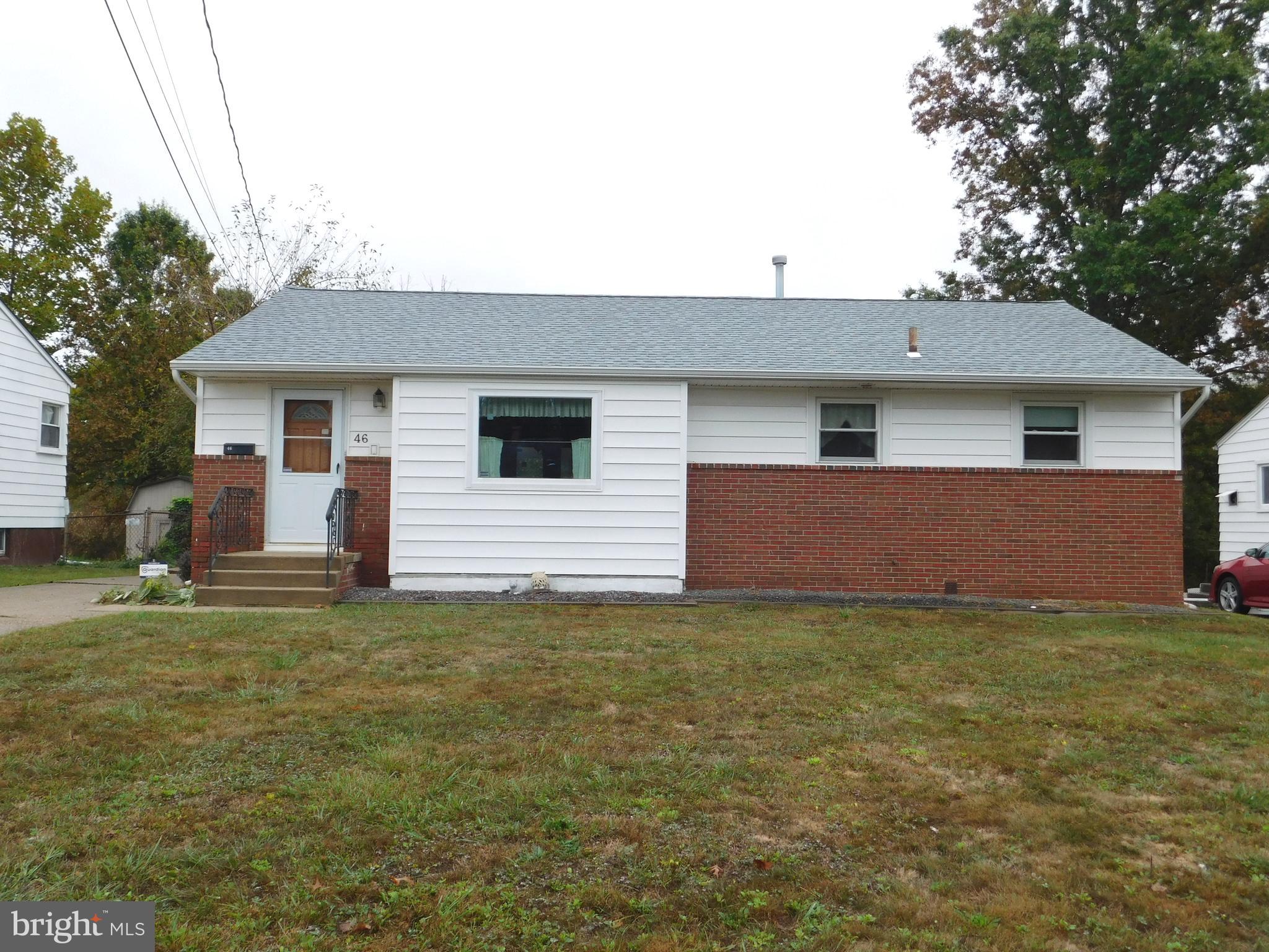 a view of a house with a backyard