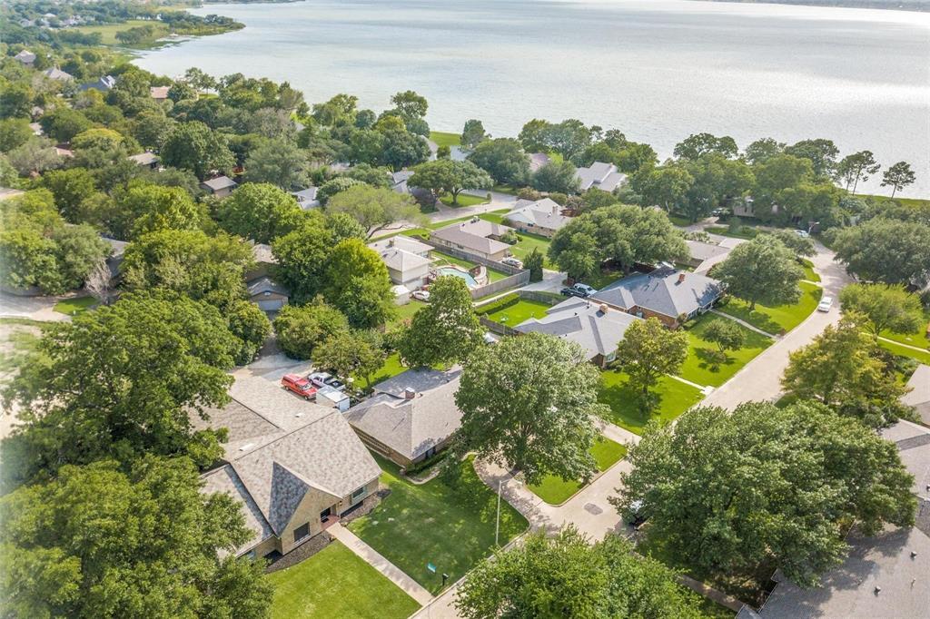 an aerial view of a house with yard swimming pool and outdoor seating