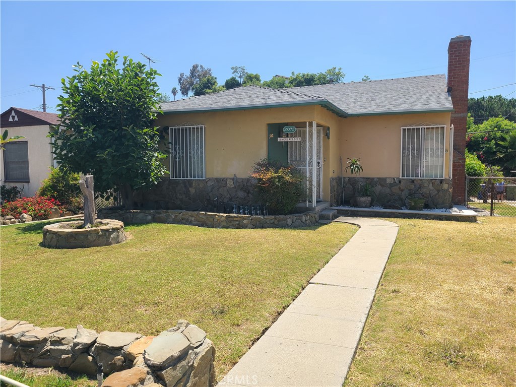 a front view of a house with swimming pool