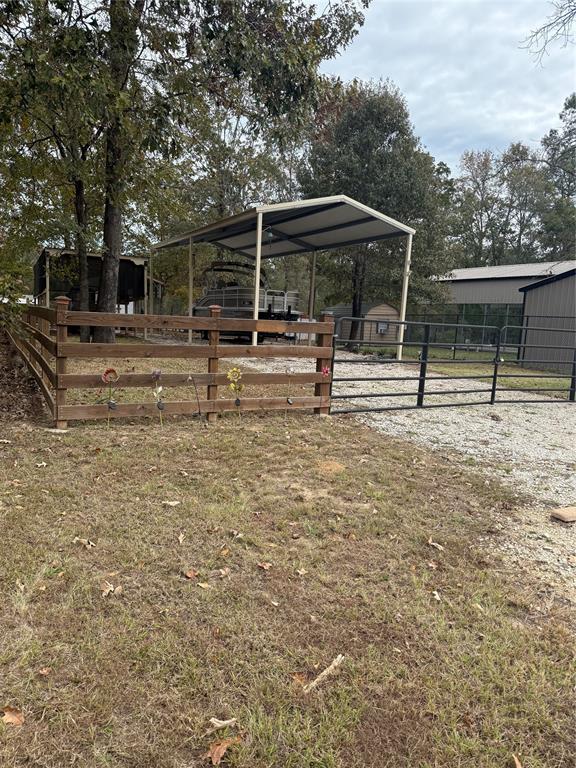 a view of house with backyard and deck