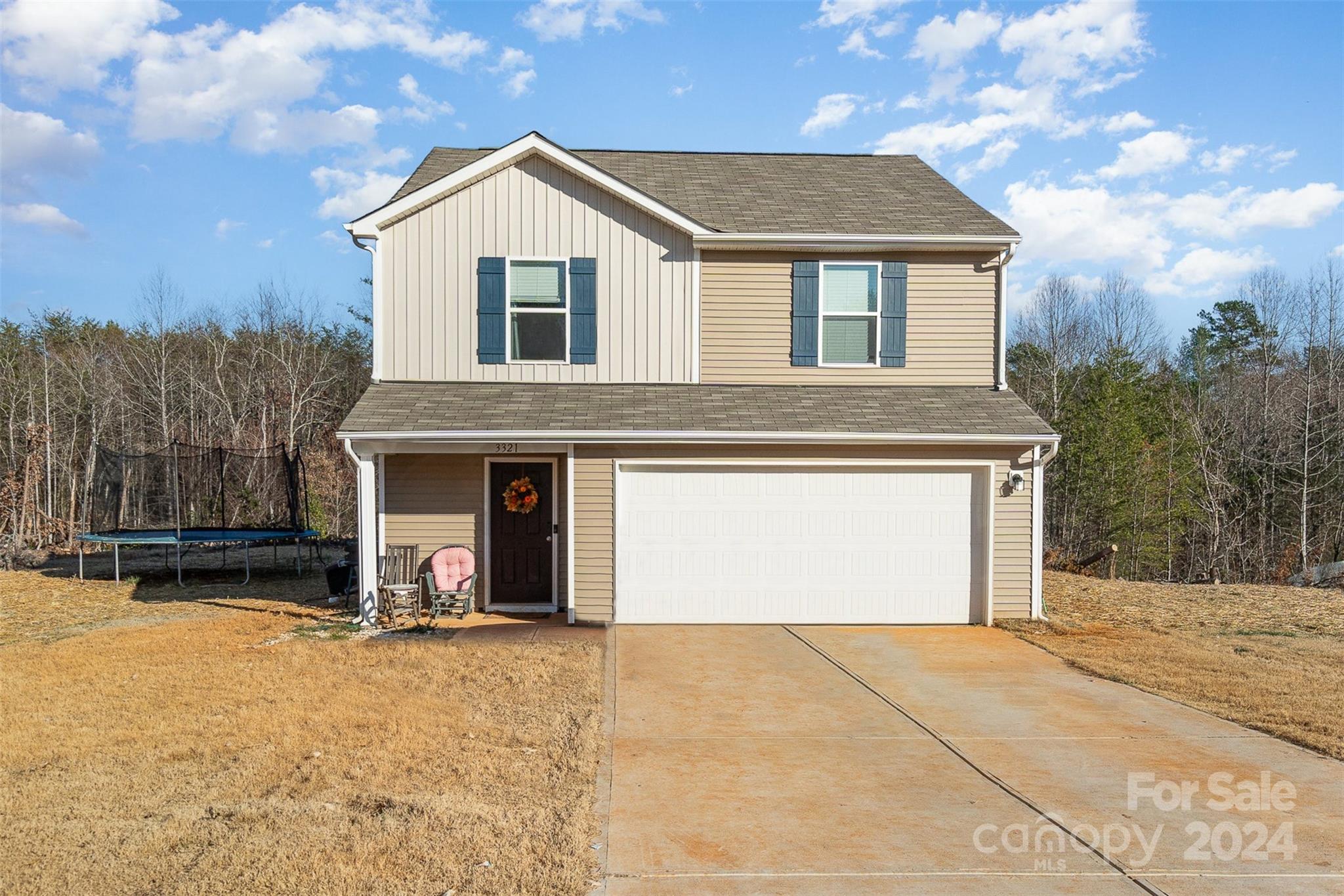 a front view of a house with yard