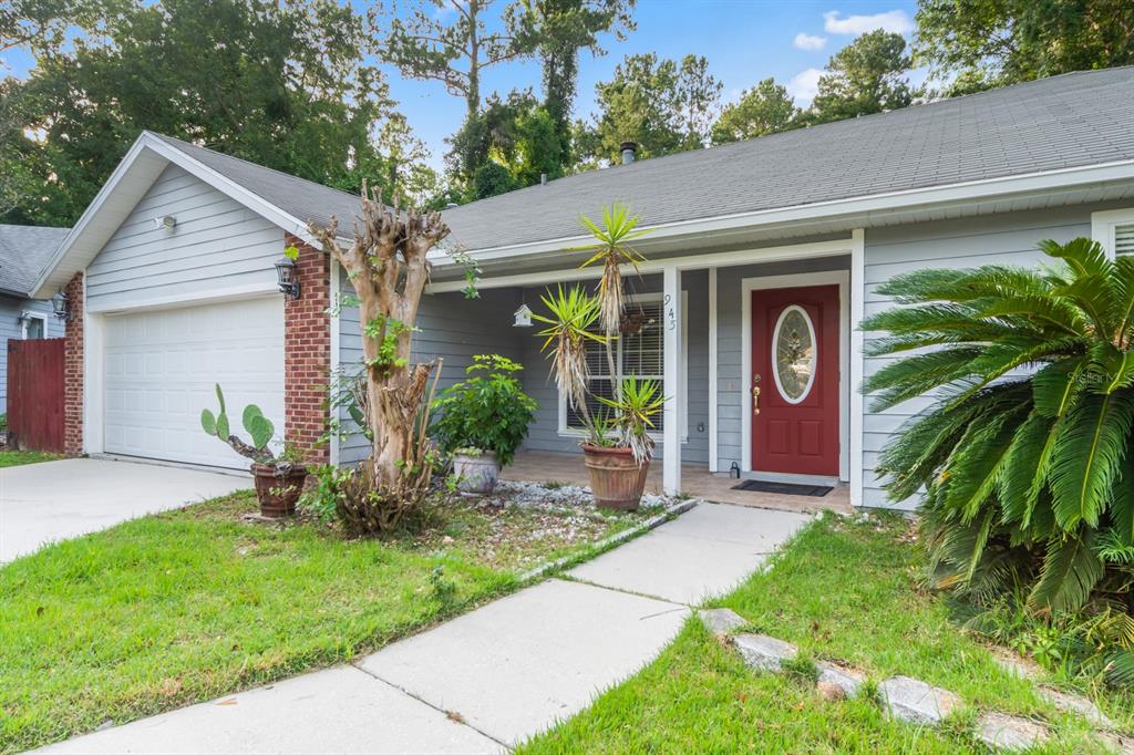 a front view of house with yard and outdoor seating