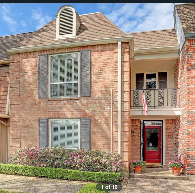 Front door entrance from gated pedestrian walkway in courtyard