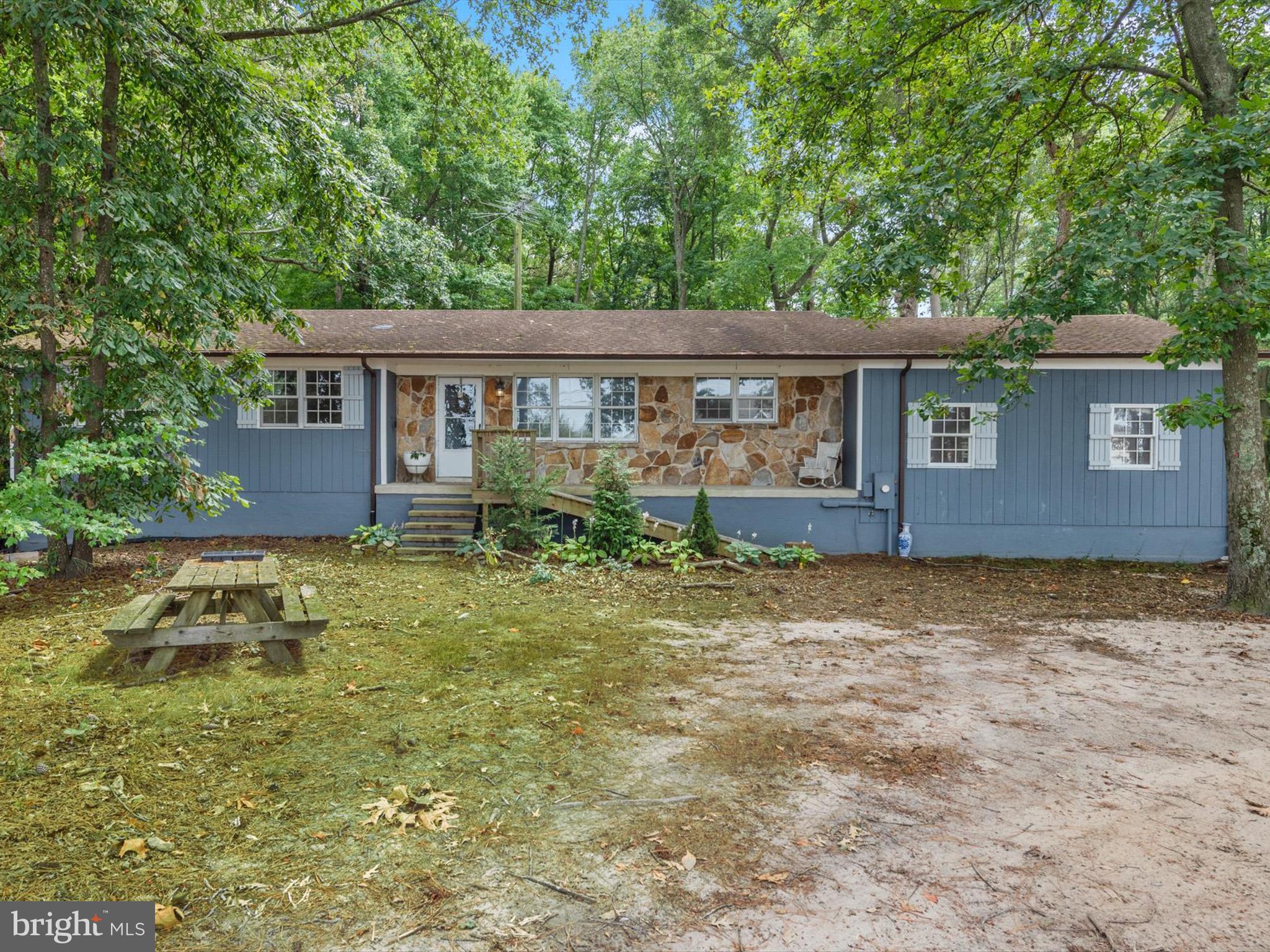 front view of a house with a yard