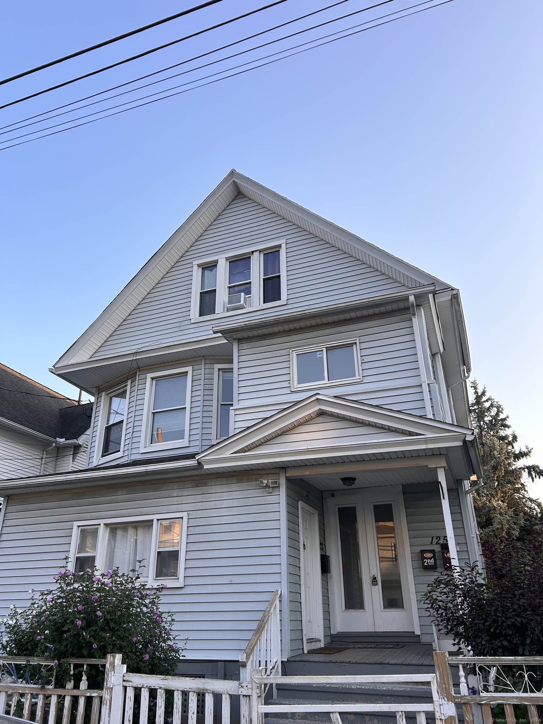 a front view of a house with yard