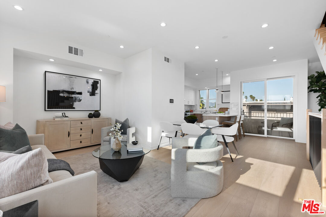 a living room with furniture and flat screen tv