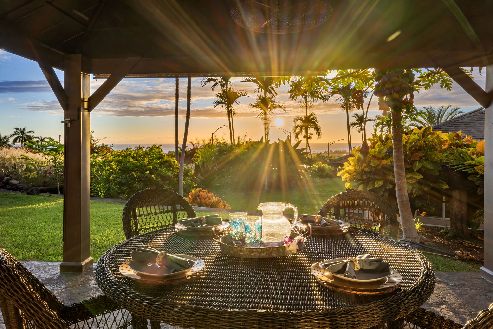 a view of a patio with table and chairs and potted plants