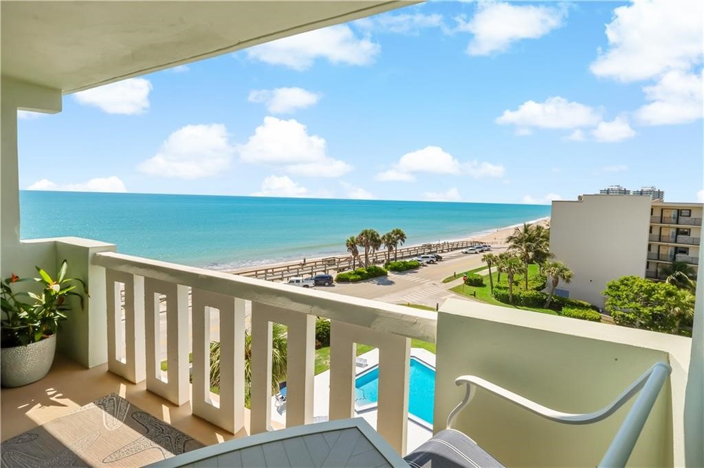 a view of balcony with furniture