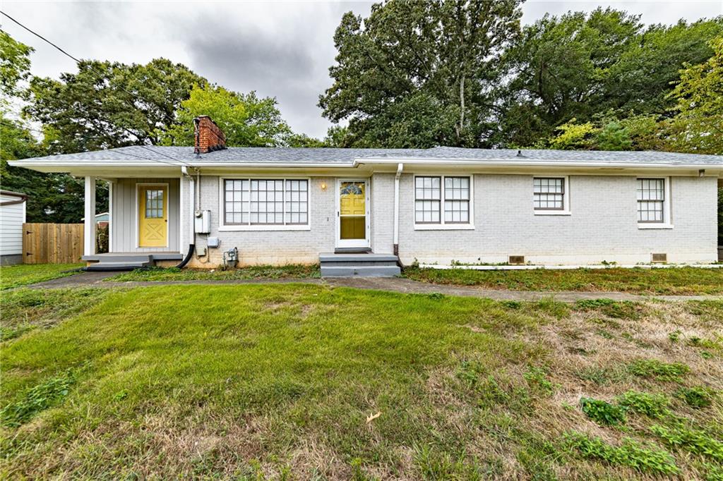 front view of a house with a yard