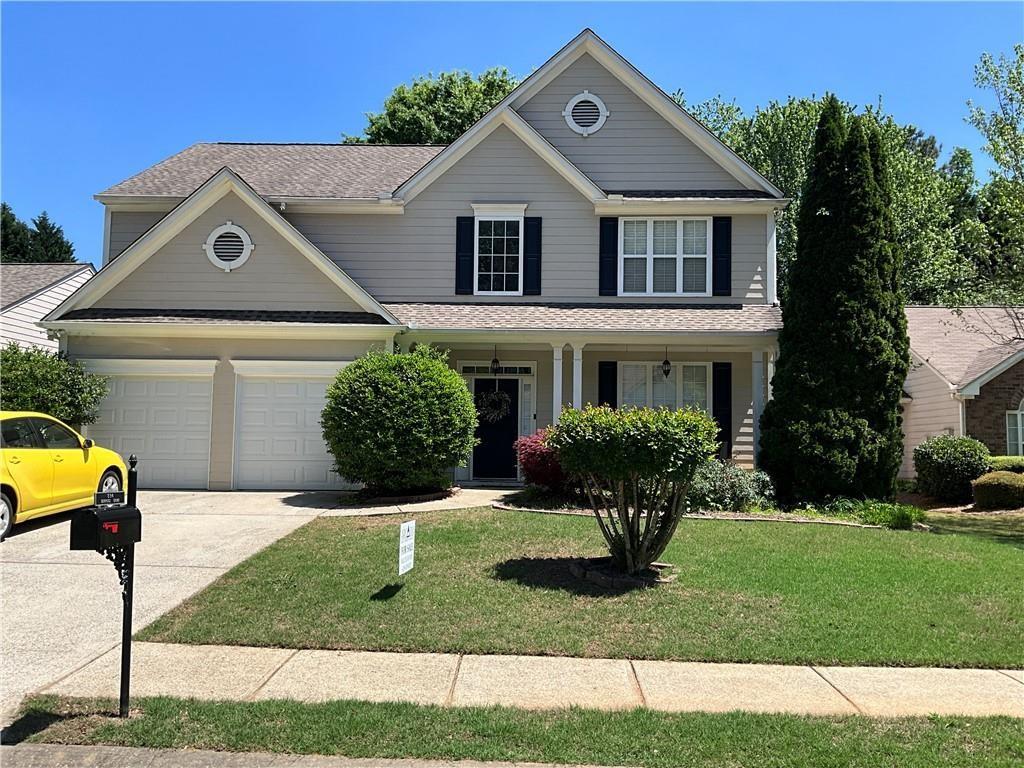 a front view of a house with a yard