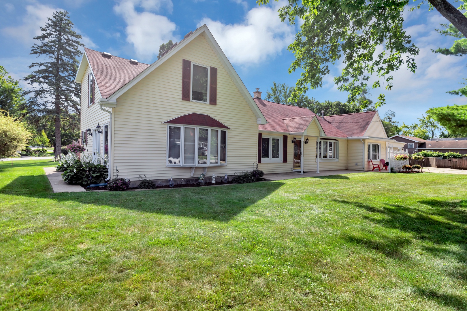 a front view of a house with a yard